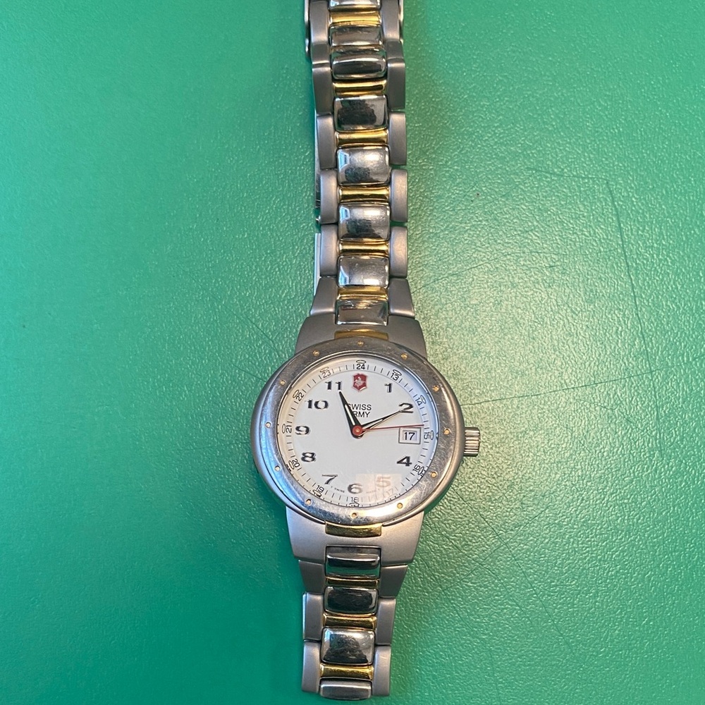 Victorinox Women’s Swiss Army Date Silver and Gold Watch with White Dial.